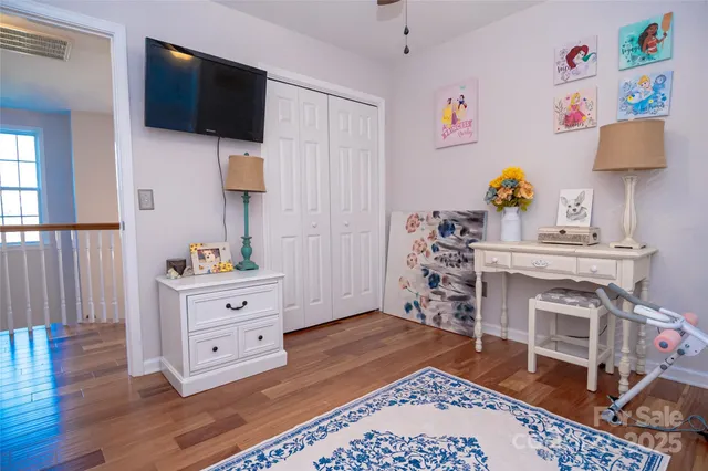 a bathroom with a toilet a sink and a window