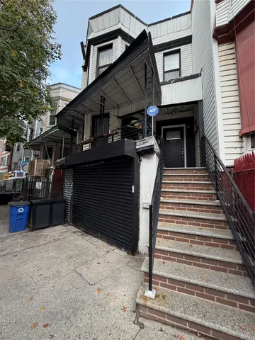 a front view of a house with a stairs