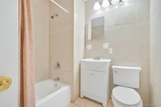 a bathroom with a toilet a sink and bathtub