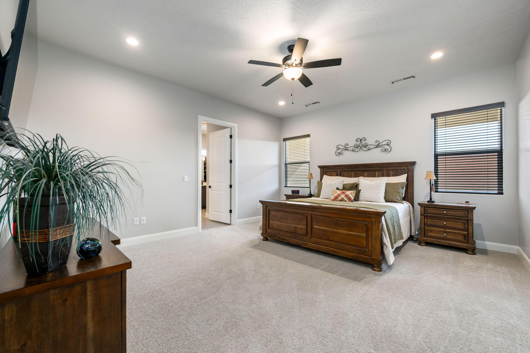 227 United Way Ivins, UT 84738 - Photo 12 of 28 Spacious primary bedroom offering comfort, natural light, and room to unwind.