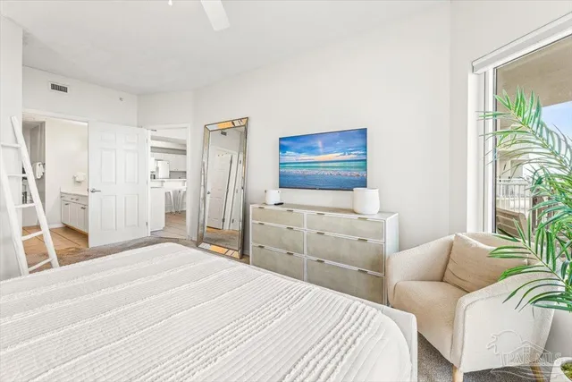 a bedroom with a bed and lamp