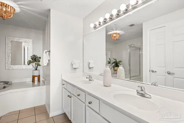a bathroom with a bathtub and a sink
