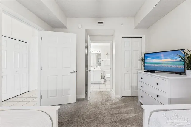 a bathroom with a toilet a sink and a mirror