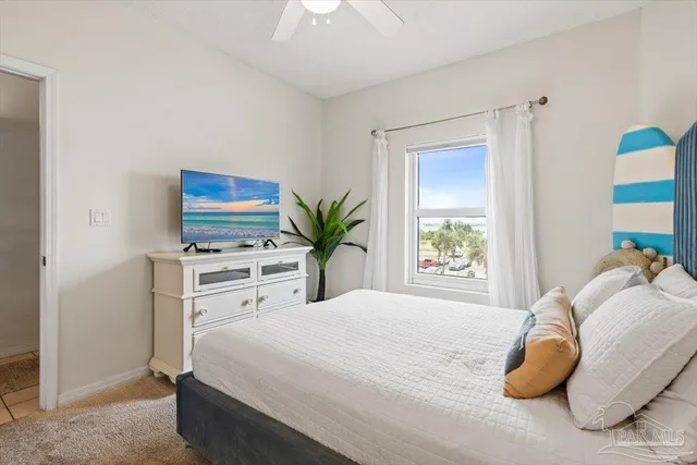 a bedroom with a bed and a view of bathroom