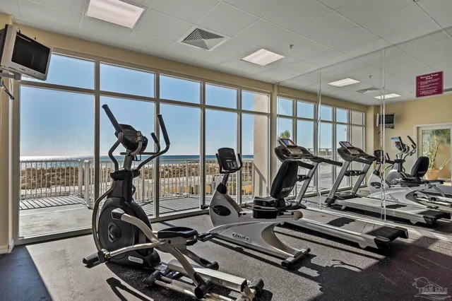 a balcony with wooden floor and city view