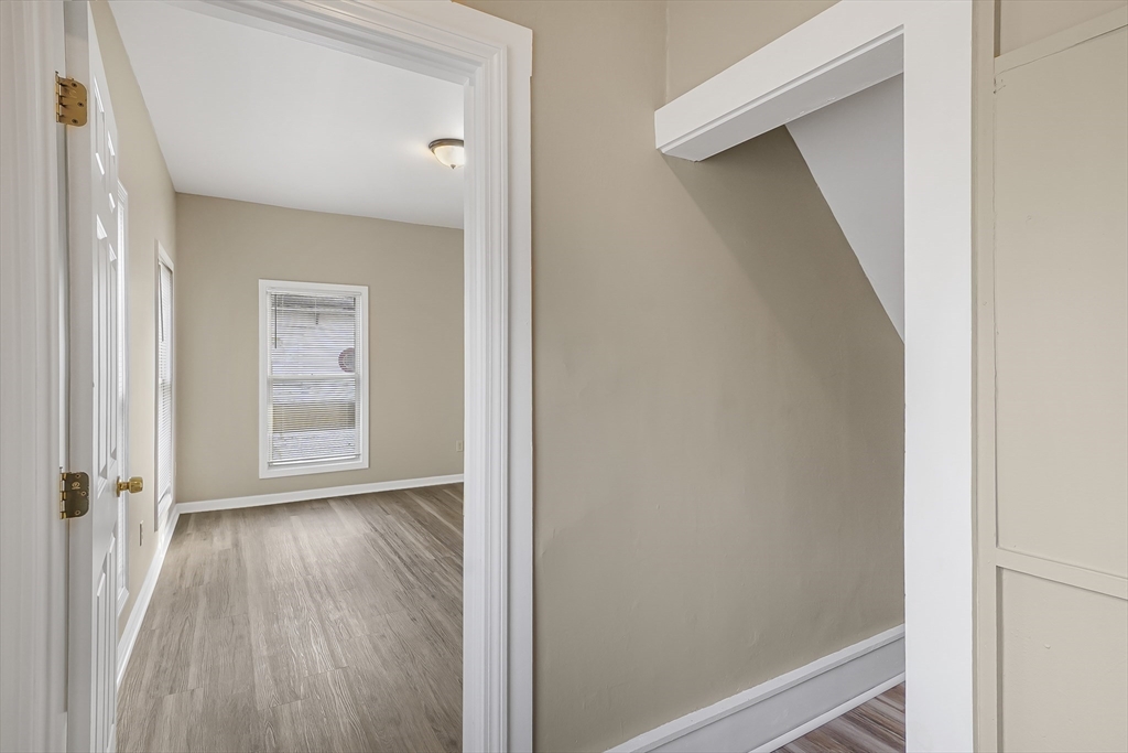 12 Franklin Avenue, Unit 2 Westfield, MA 01085 - Photo 13 of 15 a view of a hallway with wooden floor and closet