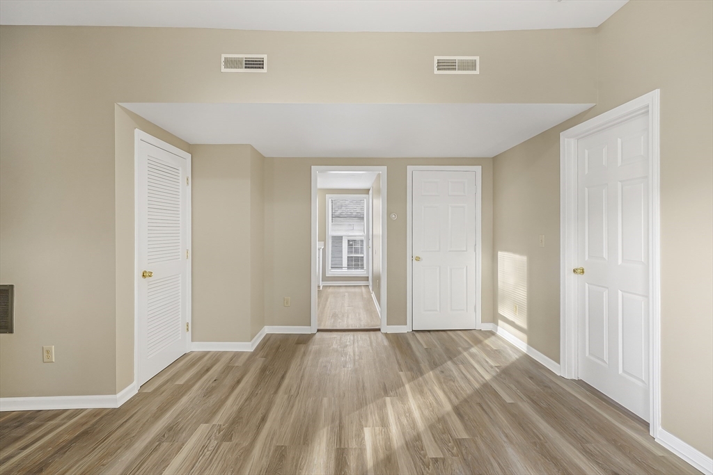 12 Franklin Avenue, Unit 2 Westfield, MA 01085 - Photo 4 of 15 a view of a room with wooden floor and gate