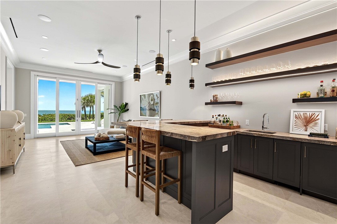 330 Blue Wave Lane Vero Beach, FL 32963 - Photo 11 of 36 a kitchen with stainless steel appliances granite countertop a sink and a stove