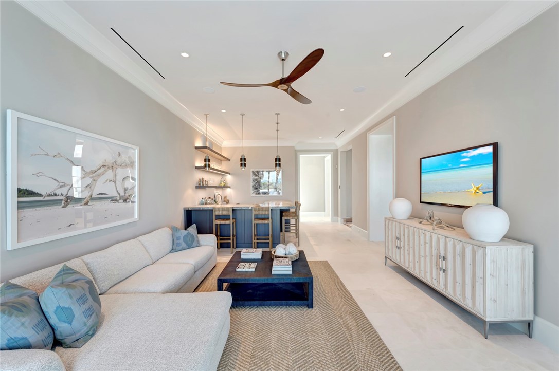 330 Blue Wave Lane Vero Beach, FL 32963 - Photo 13 of 36 a living room with furniture and a flat screen tv