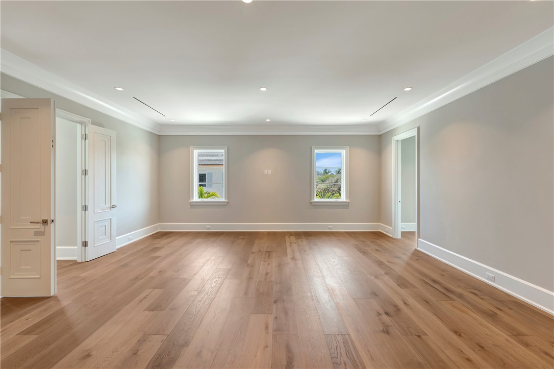 330 Blue Wave Lane Vero Beach, FL 32963 - Photo 24 of 36 an empty room with wooden floor and windows