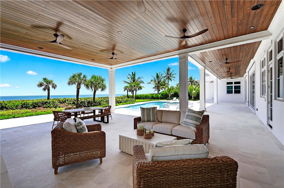 330 Blue Wave Lane Vero Beach, FL 32963 - Photo 27 of 36 a outdoor living space with patio furniture and a garden