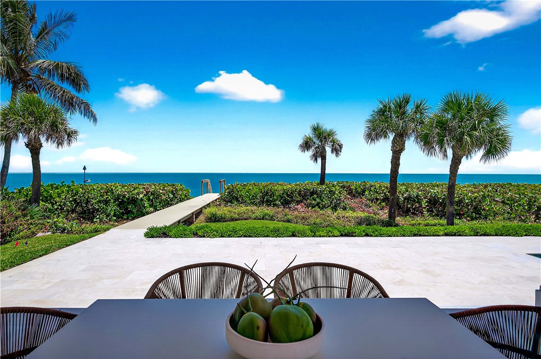 330 Blue Wave Lane Vero Beach, FL 32963 - Photo 30 of 36 a view of a table and chairs in patio