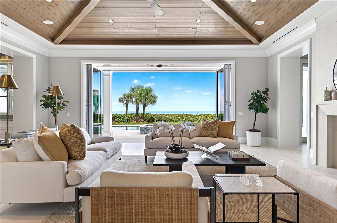 330 Blue Wave Lane Vero Beach, FL 32963 - Photo 3 of 36 a living room with furniture and a large window