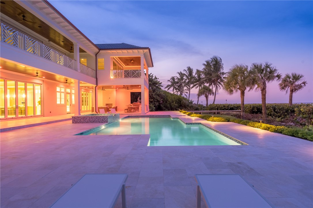 330 Blue Wave Lane Vero Beach, FL 32963 - Photo 35 of 36 a view of an swimming pool with an outdoor space and seating area