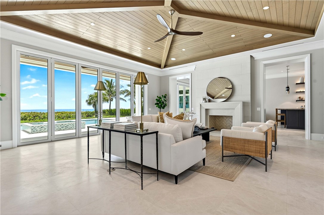 330 Blue Wave Lane Vero Beach, FL 32963 - Photo 4 of 36 a living room with furniture and a large window