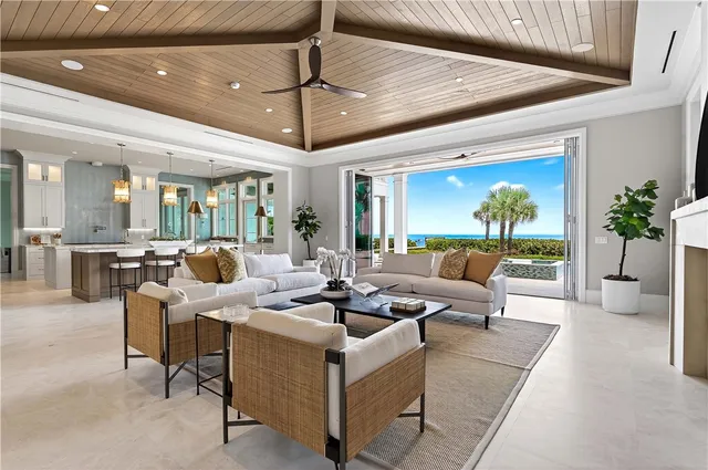 a large white kitchen with a large window