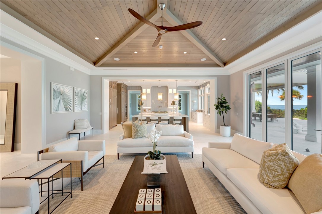 330 Blue Wave Lane Vero Beach, FL 32963 - Photo 6 of 36 a living room with furniture and a chandelier