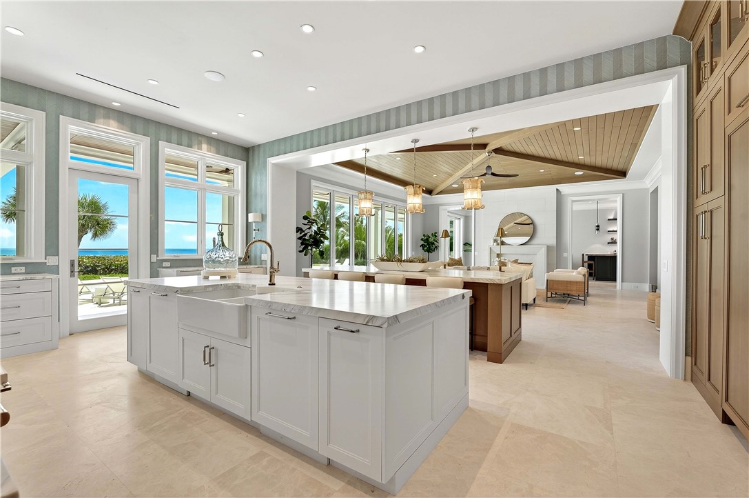 330 Blue Wave Lane Vero Beach, FL 32963 - Photo 7 of 36 a large white kitchen with a large window