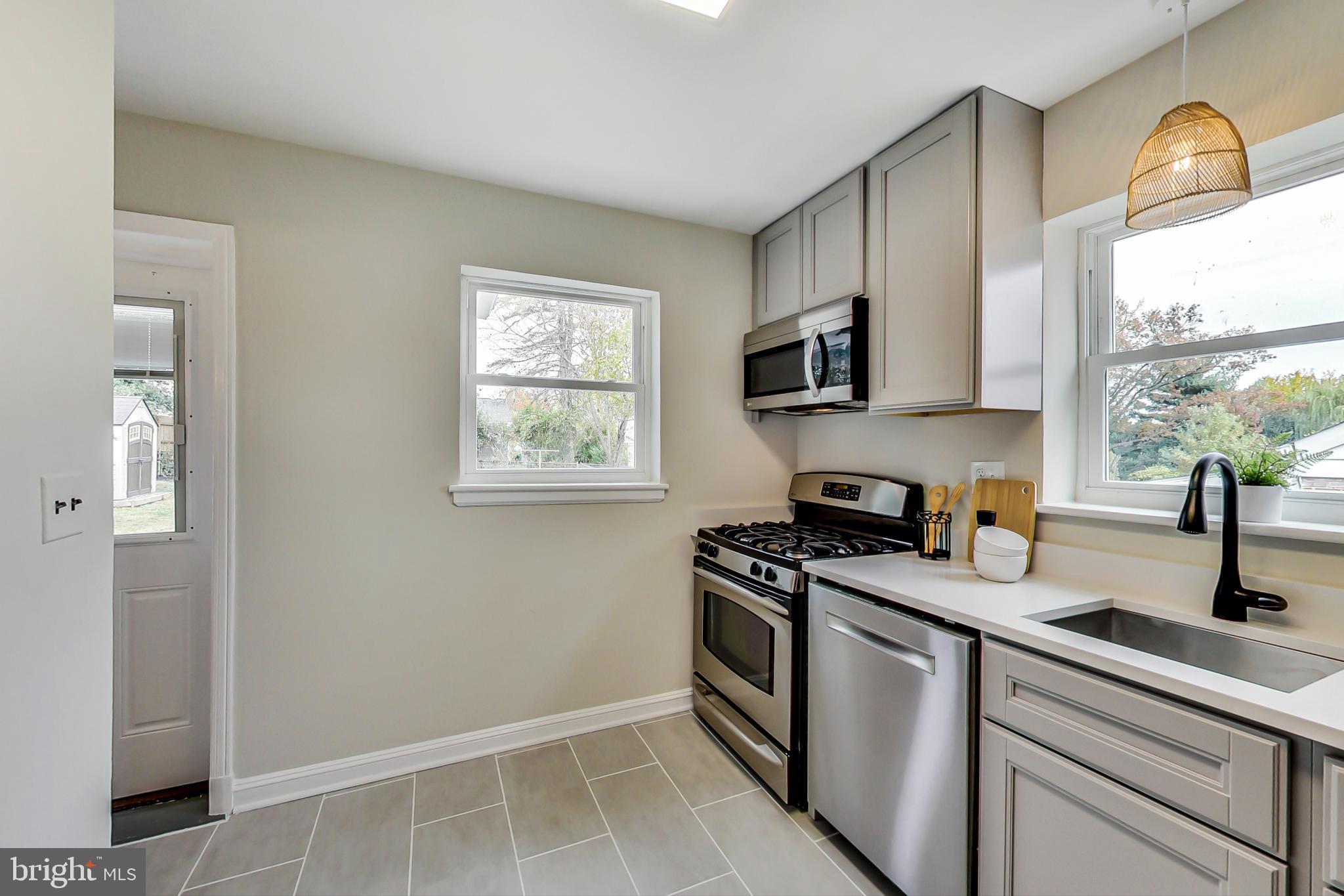 2213 Darrow Street Silver Spring, MD 20902 - Photo 10 of 37 Kitchen overlooks and opens to the patio