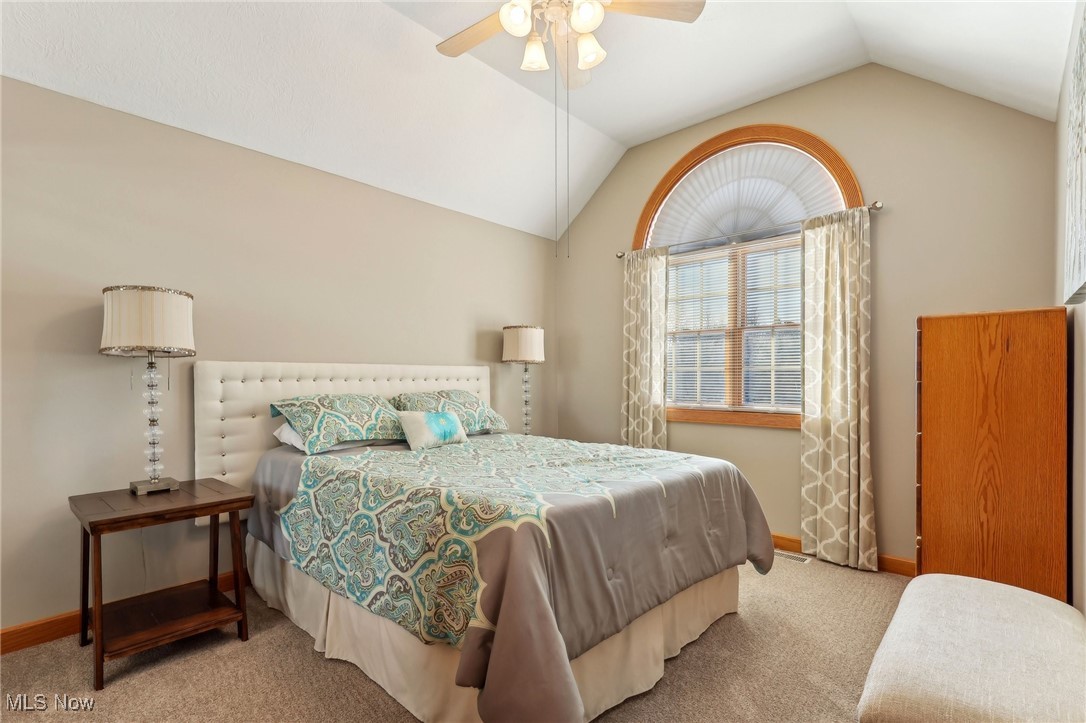 3353 Jens Way Perry, OH 44081 - Photo 29 of 49 Bedroom with light carpet, vaulted ceiling, and ceiling fan