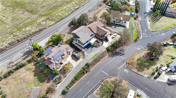 an aerial view of a house with a lake view