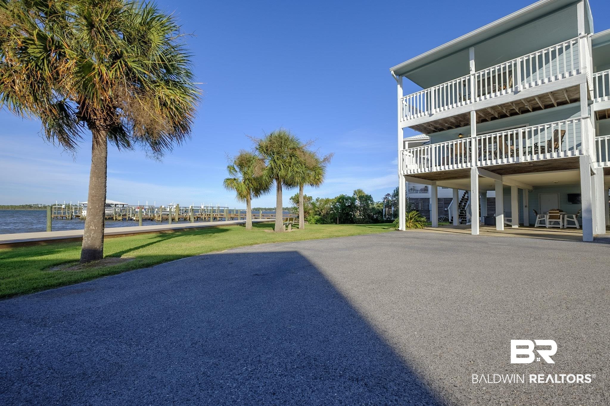 25861 Canal Road, Unit 1 Orange Beach, AL 36561 - Photo 53 of 53 Exterior space featuring a water view and stairway