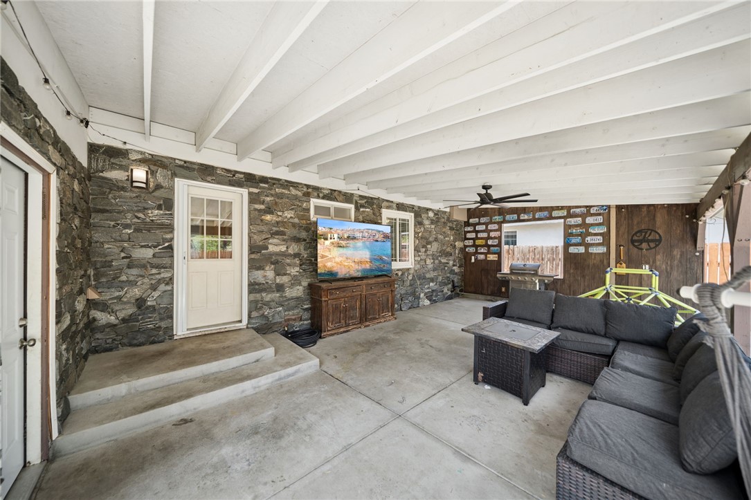 4869 Serrano Place Riverside, CA 92504 - Photo 33 of 40 Additional patio view showcasing the generous covered space and inviting outdoor living setup.