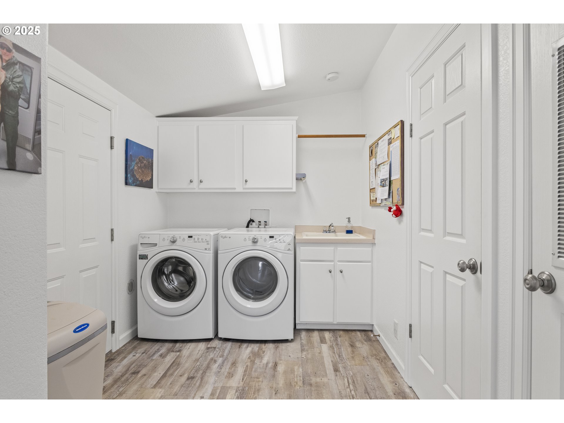 852 Munsel Creek Loop Florence, OR 97439 - Photo 12 of 48 a utility room with cabinets washer and dryer