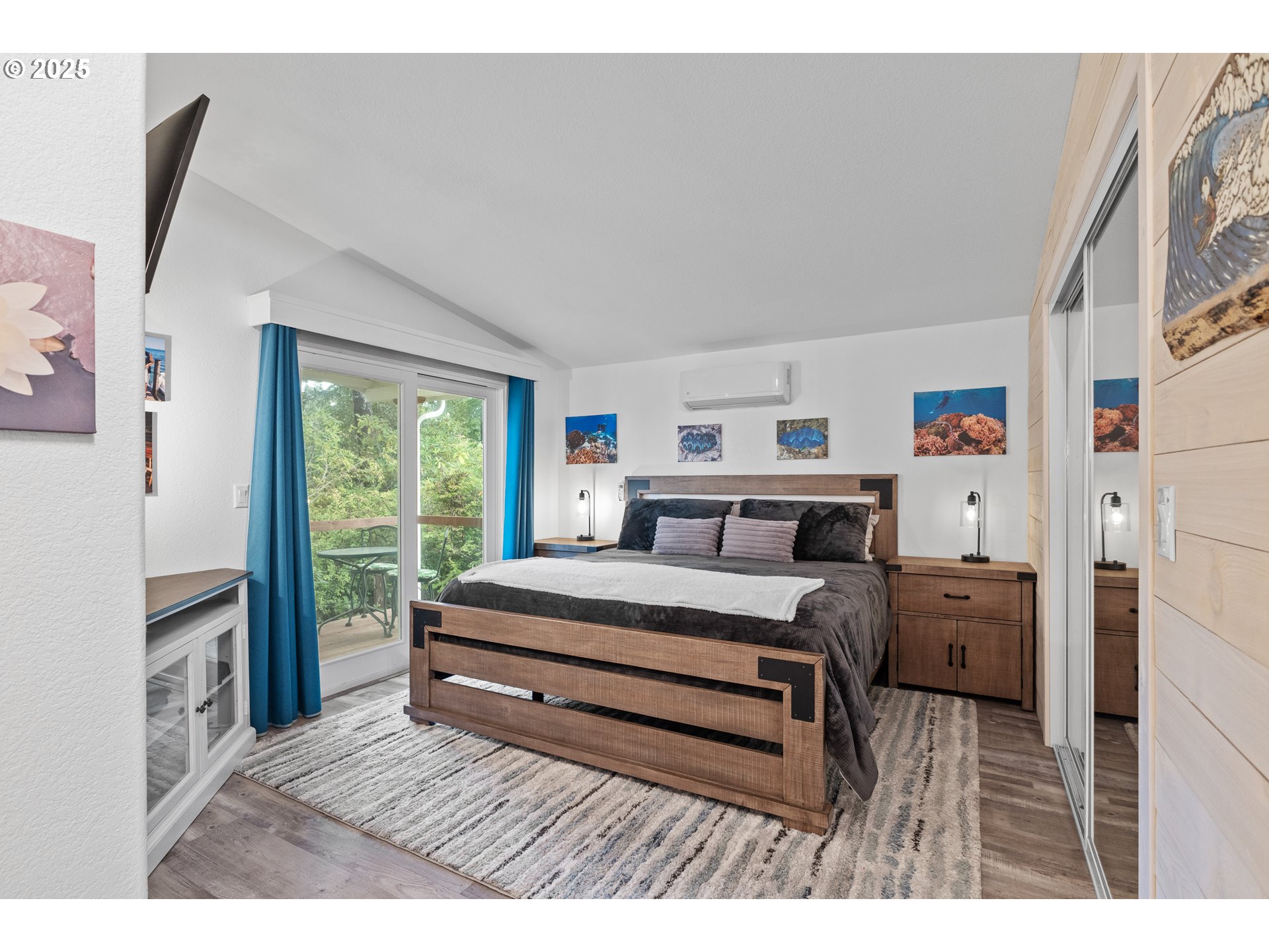 852 Munsel Creek Loop Florence, OR 97439 - Photo 30 of 48 a bedroom with a bed and a large window