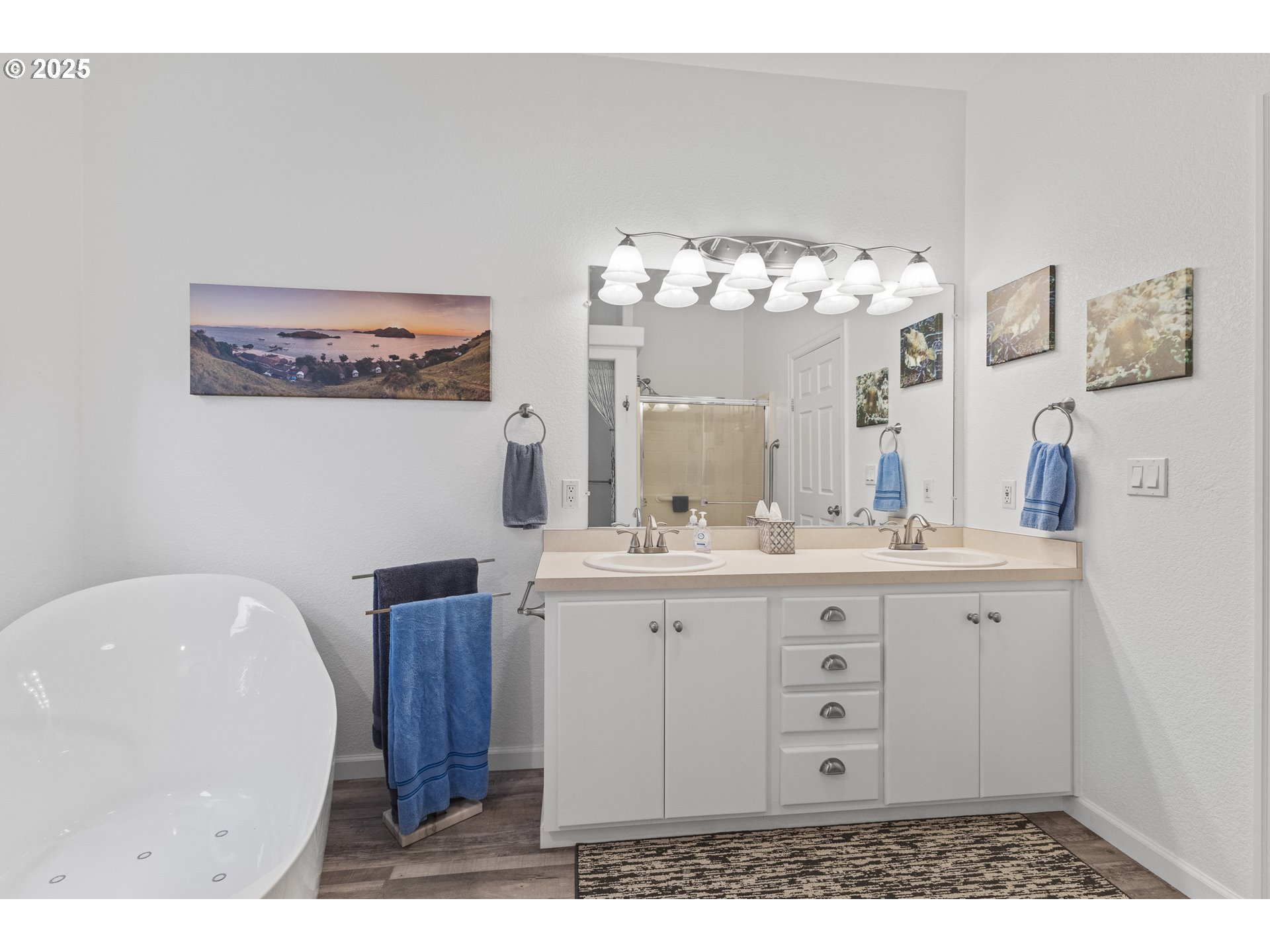 852 Munsel Creek Loop Florence, OR 97439 - Photo 34 of 48 a bathroom with a sink vanity and mirror