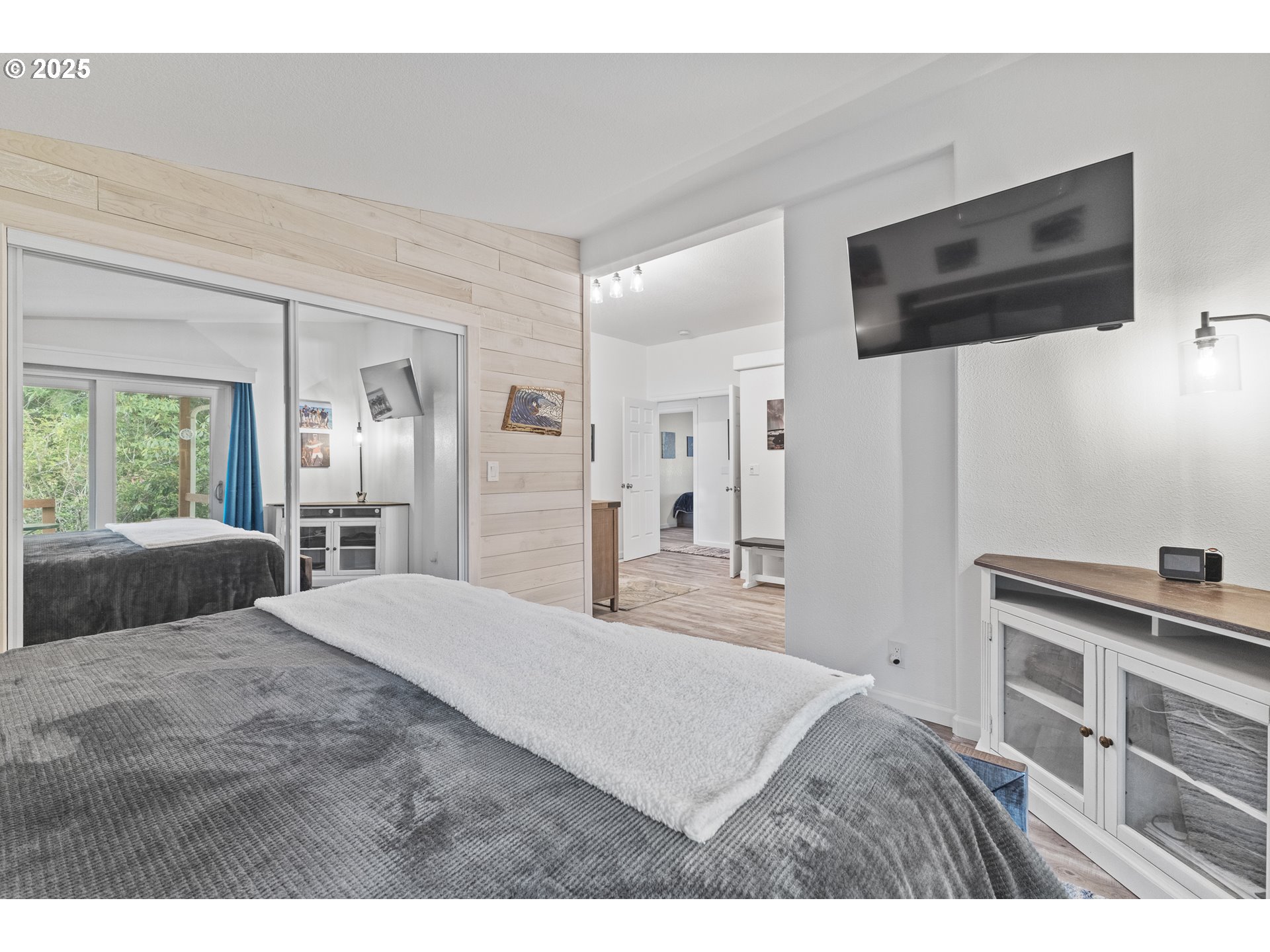 852 Munsel Creek Loop Florence, OR 97439 - Photo 35 of 48 a bedroom with a bed and a flat screen tv