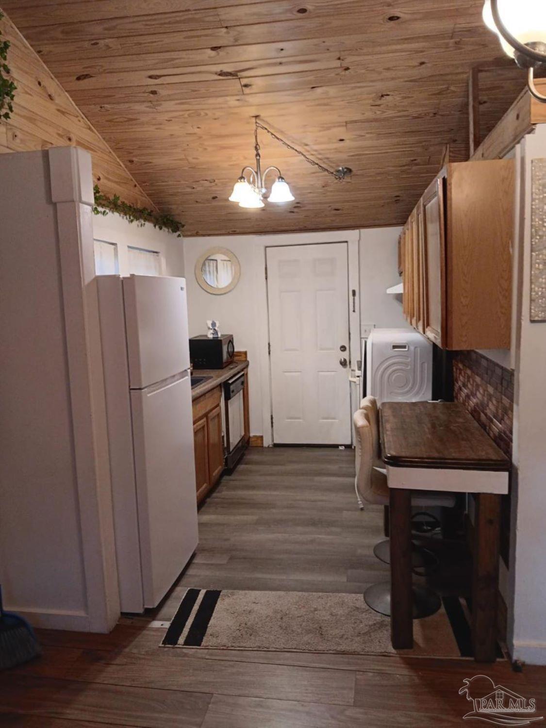 612 Rentz Avenue Pensacola, FL 32507 - Photo 1 of 18 a kitchen with granite countertop a refrigerator and a stove