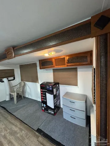 a room with furniture and view of living room