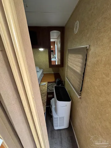 a room with wooden floor and furniture