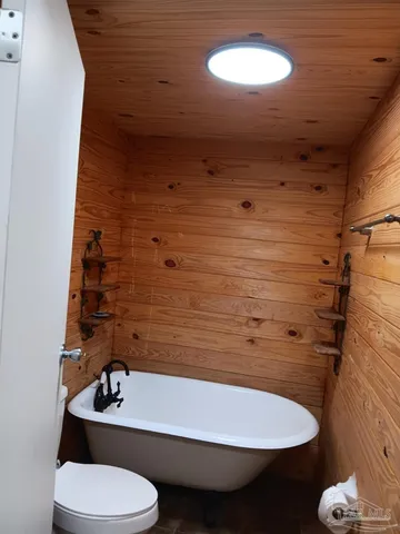 a bathroom with a sink toilet and a mirror