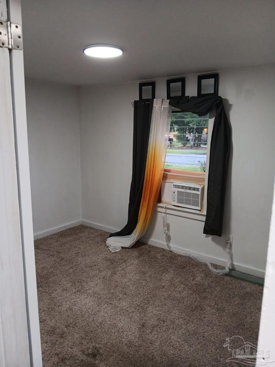 612 Rentz Avenue Pensacola, FL 32507 - Photo 4 of 18 a view of a room with gym equipment