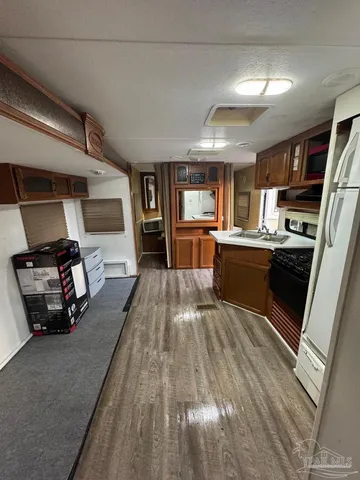 a kitchen with granite countertop lots of counter top space and stainless steel appliances