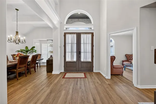 a view of a livingroom with furniture and hardwood floor