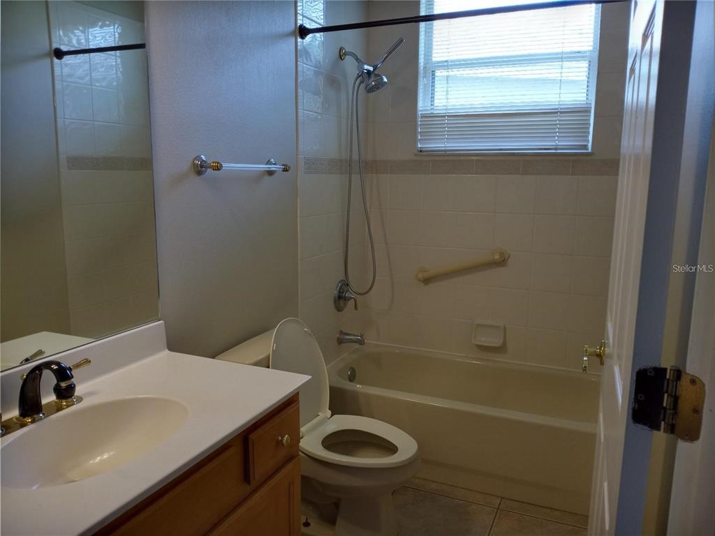 6506 Waters Edge Way Lakewood Ranch, FL 34202 - Photo 8 of 14 a bathroom with a sink a toilet and shower