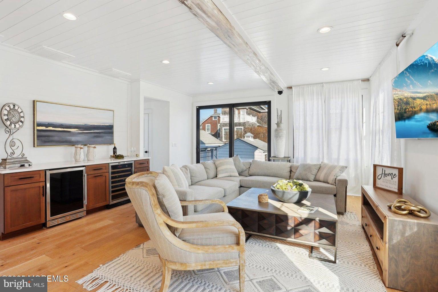 211 4th Street Beach Haven, NJ 08008 - Photo 18 of 48 a living room with furniture and a flat screen tv