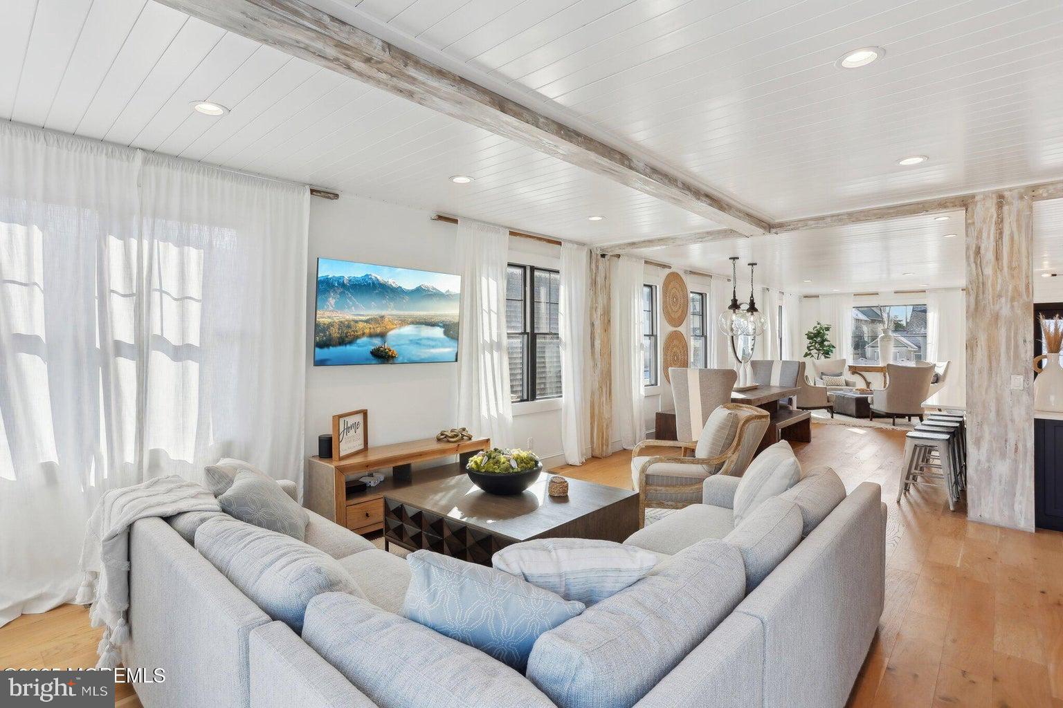211 4th Street Beach Haven, NJ 08008 - Photo 20 of 48 a living room with furniture and a large window