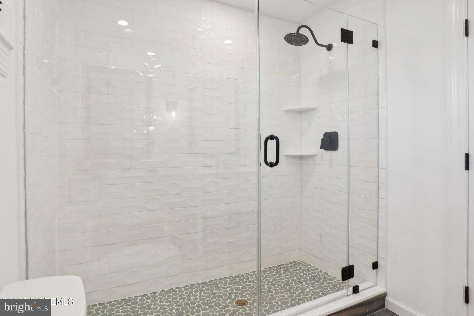 211 4th Street Beach Haven, NJ 08008 - Photo 26 of 48 a bathroom with a shower