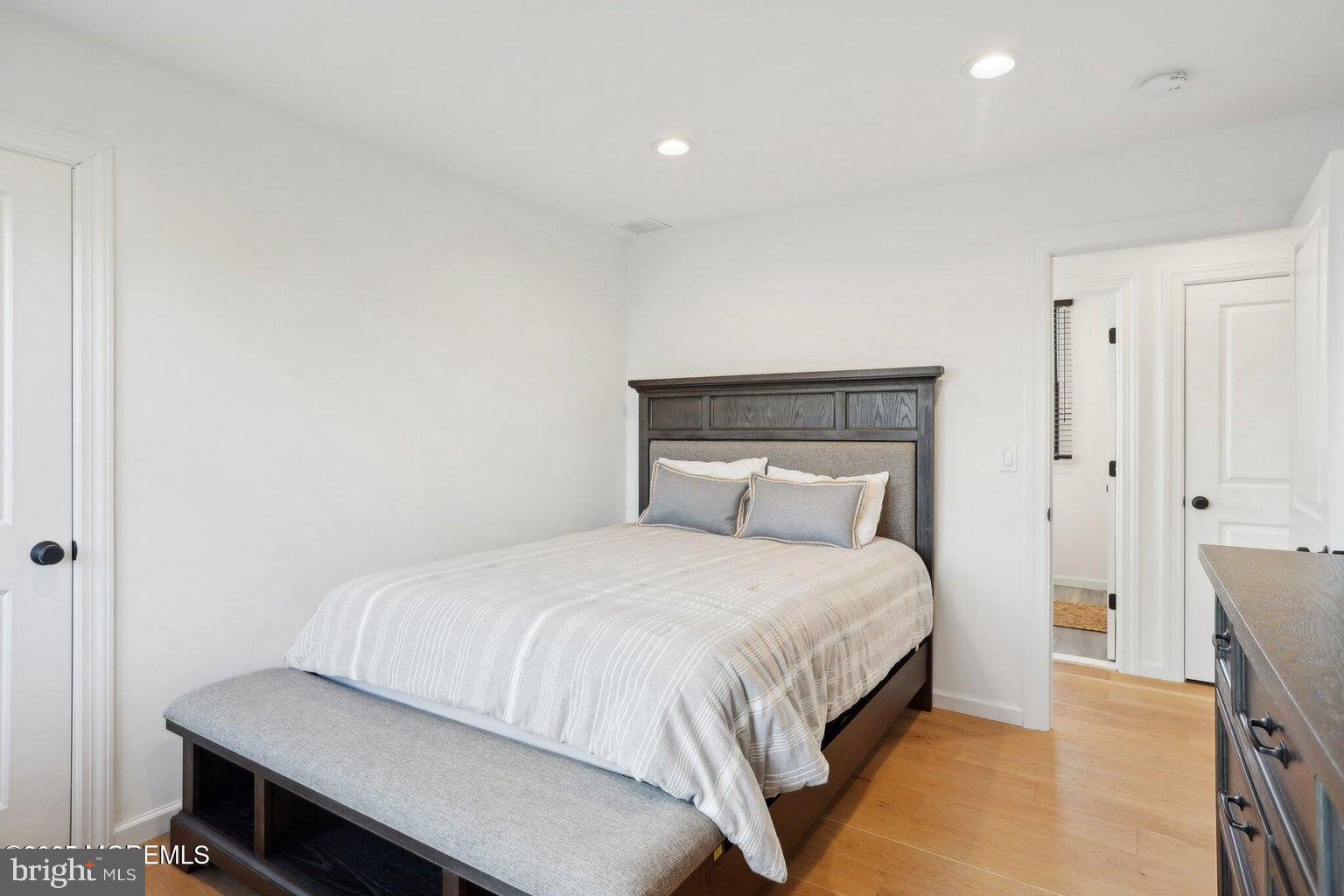 211 4th Street Beach Haven, NJ 08008 - Photo 27 of 48 a bedroom with a bed and a table