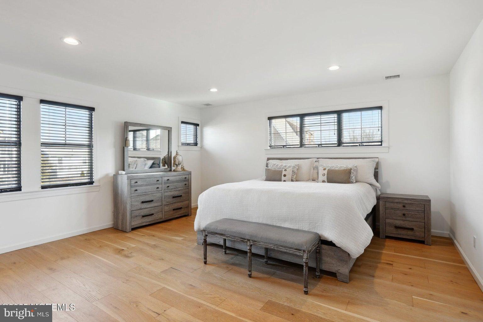 211 4th Street Beach Haven, NJ 08008 - Photo 33 of 48 a bedroom with a bed and window