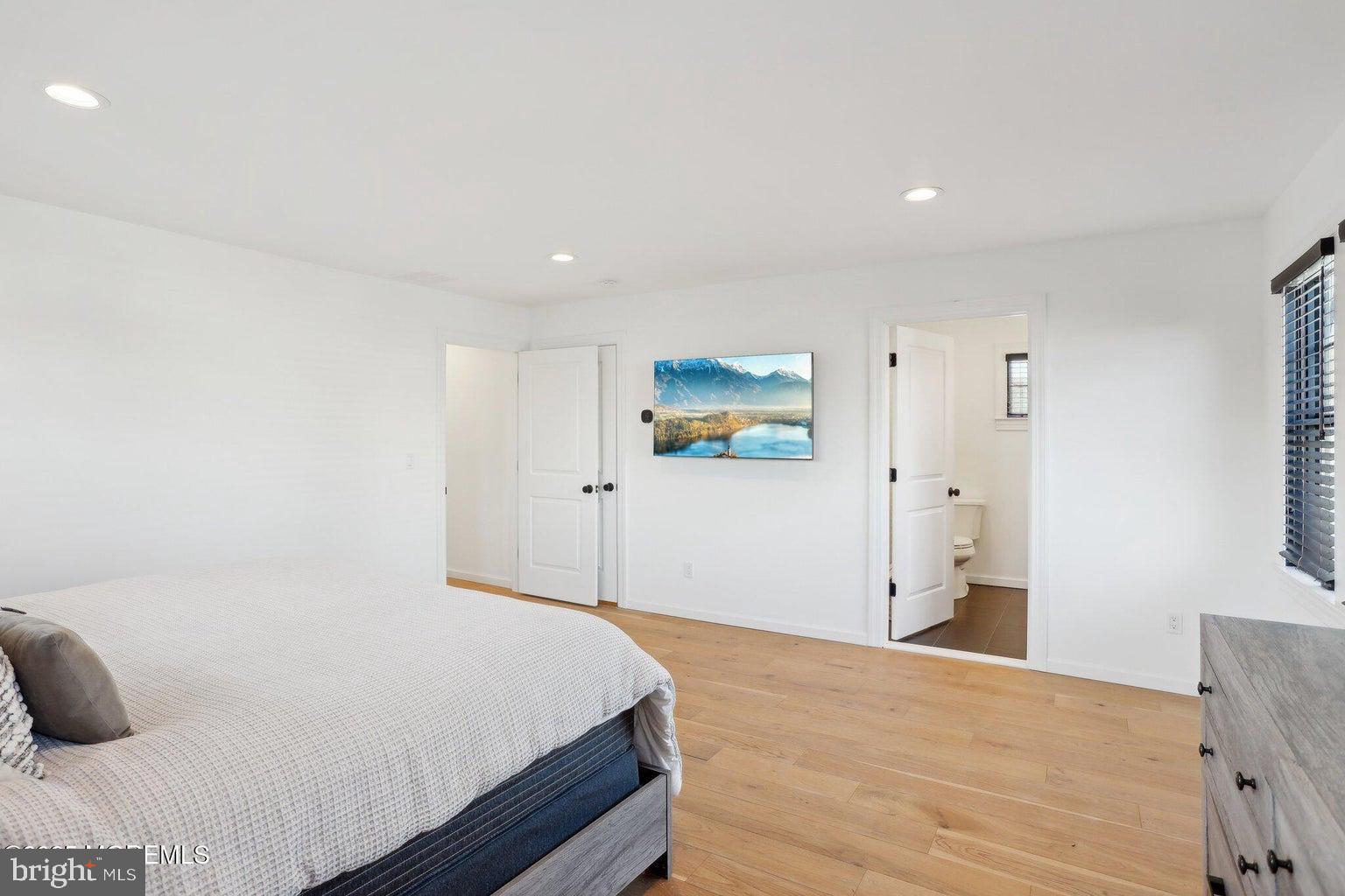 211 4th Street Beach Haven, NJ 08008 - Photo 35 of 48 a bedroom with a bed and a cabinets