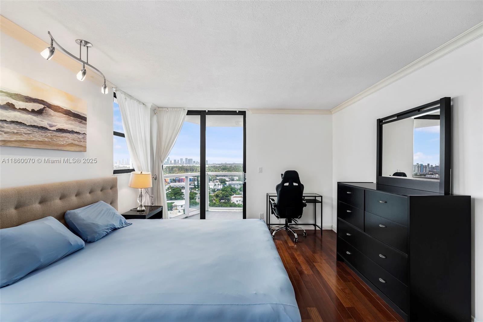 2401 Collins Avenue, Unit 1808 Miami Beach, FL 33140 - Photo 20 of 62 a living room with furniture fireplace and a large window