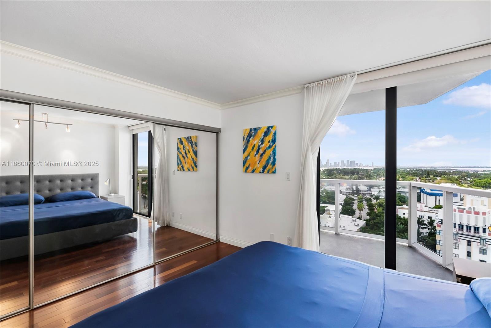 2401 Collins Avenue, Unit 1808 Miami Beach, FL 33140 - Photo 31 of 62 a view of a living room hardwood floor and ceiling window