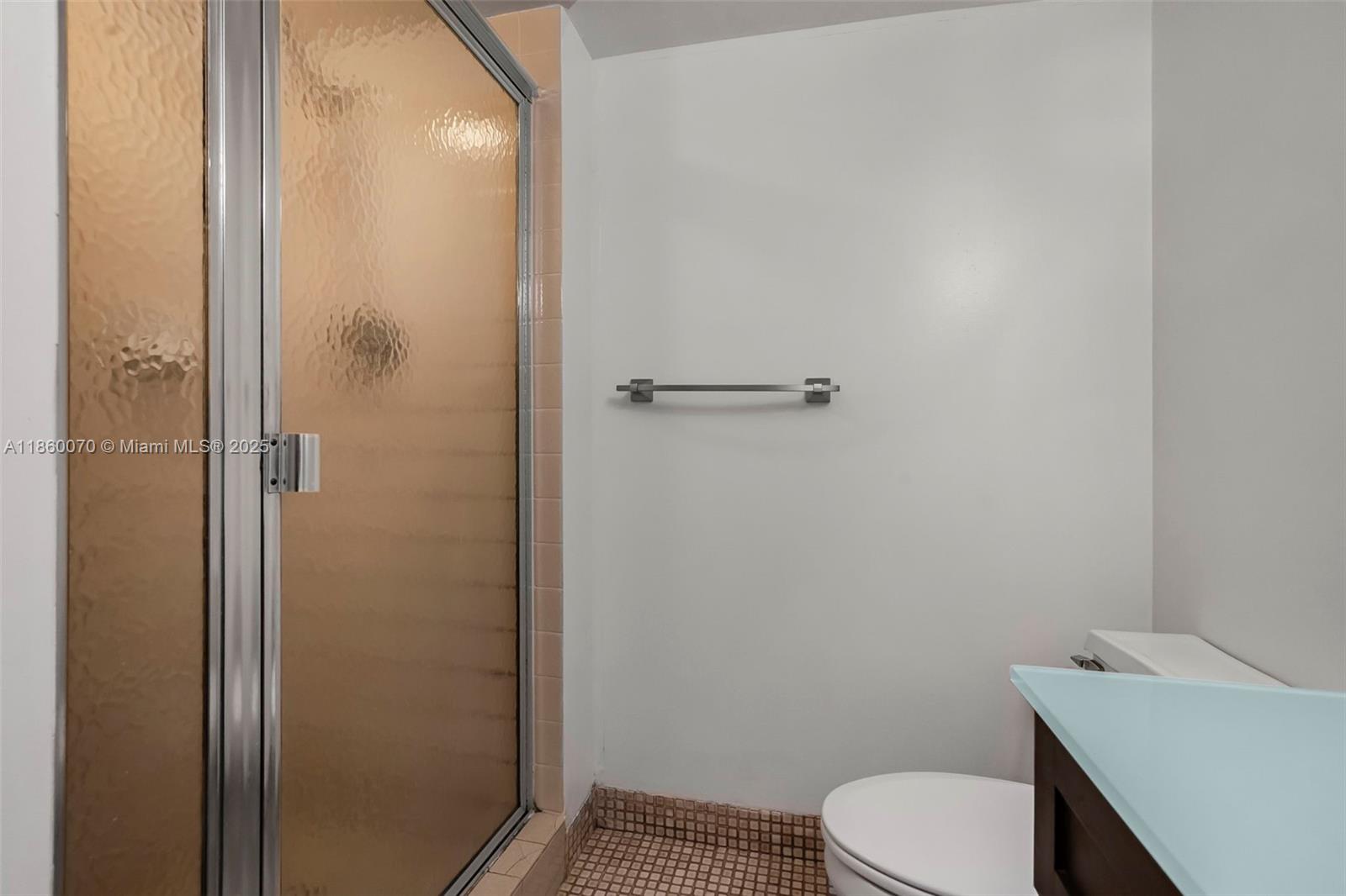 2401 Collins Avenue, Unit 1808 Miami Beach, FL 33140 - Photo 35 of 62 a bathroom with a toilet and a sink