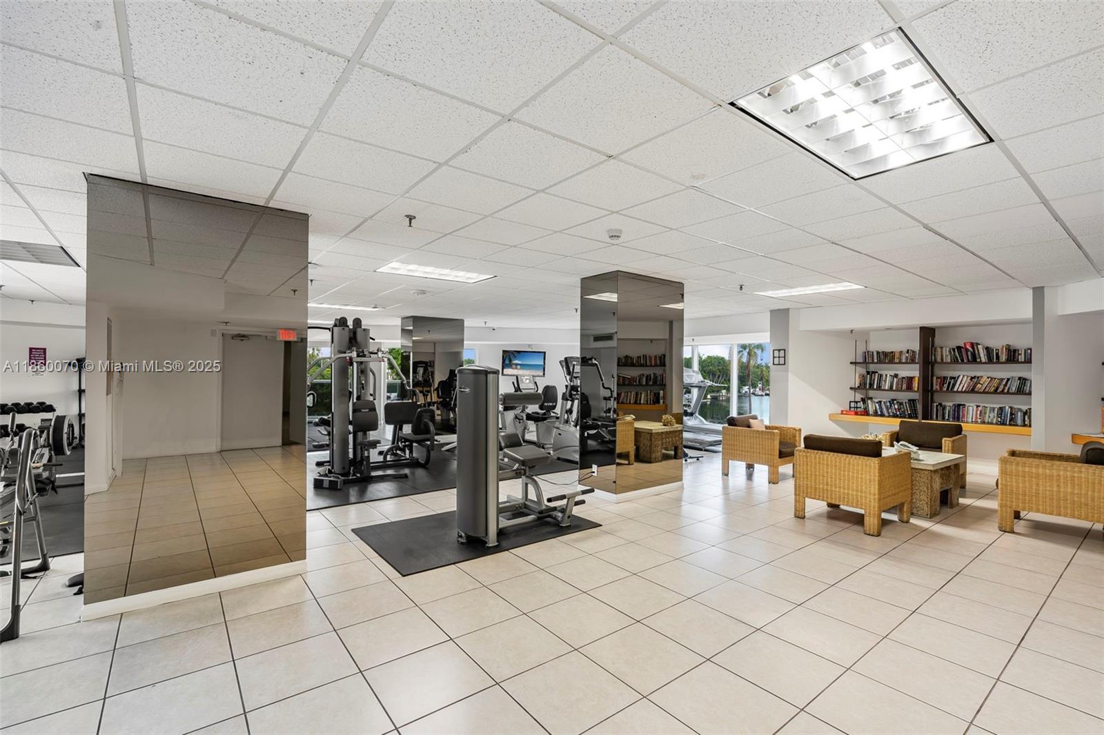 2401 Collins Avenue, Unit 1808 Miami Beach, FL 33140 - Photo 45 of 62 a view of a livingroom with furniture and a chandelier