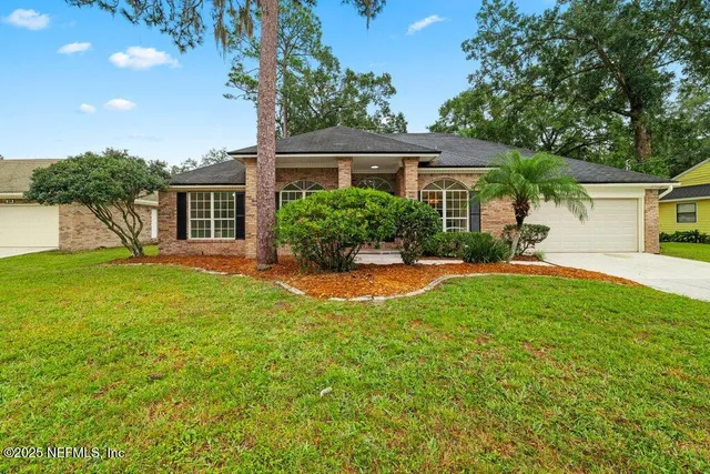 front view of a house with a yard
